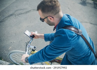Man on his bike using smartphone