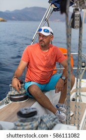 Man On His Sailing Yacht Boat.