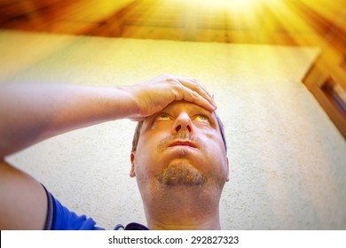 Man On A Hot Summer Day In Front Of His House