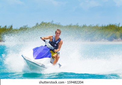 Man On Jet Ski Having Fun In Ocean