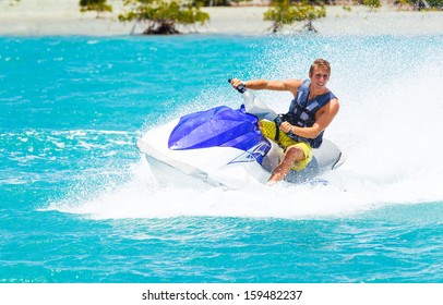 Man On Jet Ski Having Fun In Ocean