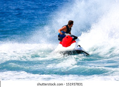 Man On Jet Ski Jump On The Wave