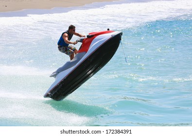 A Man On Jet Ski Jump On The Wave 