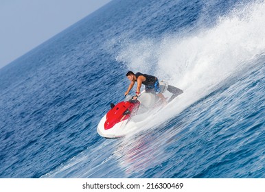 Man On Jet Ski Jump On The Wave 