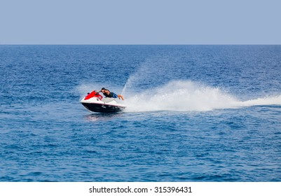 Man On Jet Ski Jump On The Wave