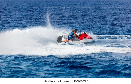 Man On Jet Ski Jump On The Wave