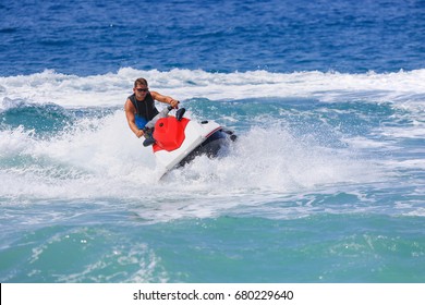 Man On Jet Ski Jump On The Wave