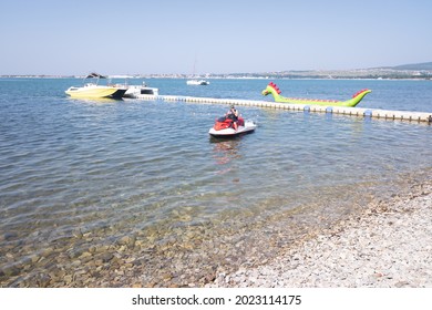 A Man On A Jet Ski Turns On The Ignition To Go For A Ride On The Sea. Copy Space.