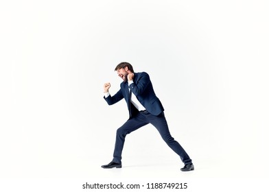 the man on a light background spread his legs wide                               - Shutterstock ID 1188749215