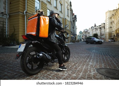 Man On Motorbike With The Dog Inside Special Thermo Bag For Delivery Food On The Street.Food Delivery Service.