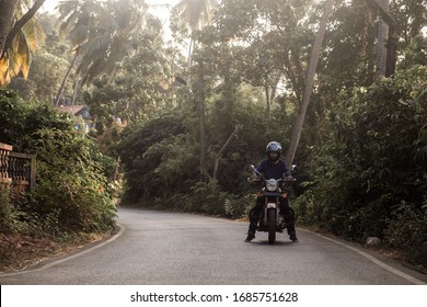 A Man On Motorcycle On Road In GOA Village