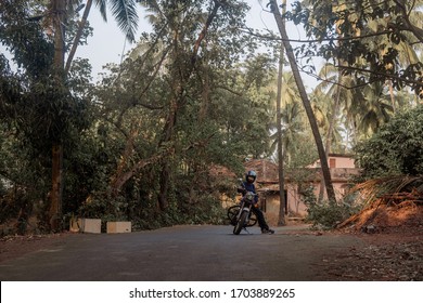 A Man On Motorcycle On Road In GOA Village