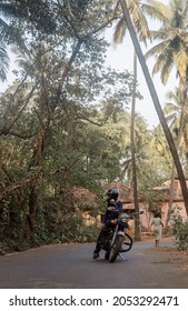 A Man On Motorcycle On Road In GOA Village