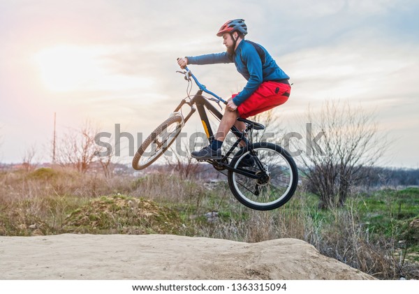 Man On Mountain Bike Performing Dirt Stock Photo (Edit Now) 1363315094