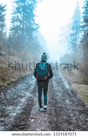 Similar – Young man running outdoors during workout in a forest