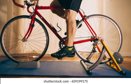 Man On Road Bike Indoors On Stationary Trainer