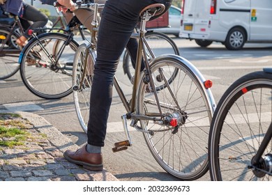 Man On Single Speed Bike Is Waiting At The Traffic Light