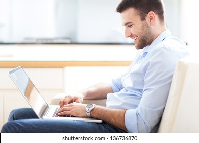 Man On Sofa With Laptop