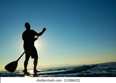 Man On Stand Up Paddle Board