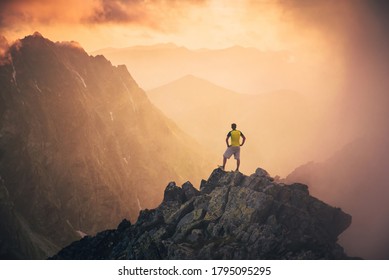 Man on the top of the hill watching wonderful scenery in mountains during summer colorful sunset in High Tatras in Slovakia. Travel, adventure or expedition concept - Shutterstock ID 1795095295