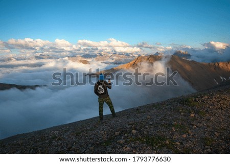 Similar – Image, Stock Photo Backpacker resting.