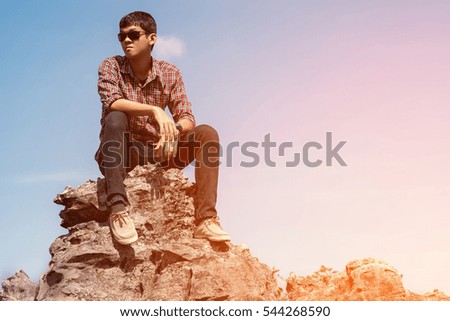 Similar – black haired man posing with sunglasses