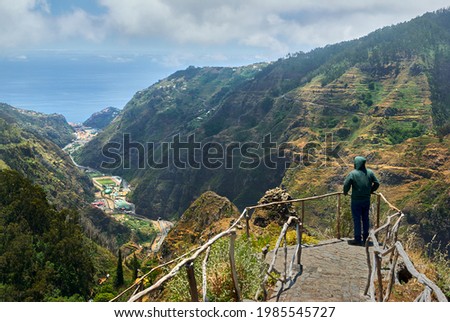 man on viewpoint madeira island, Espigão. On top of the mountain with view to the Valley of Serra de Água
