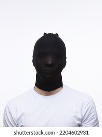 A Man On A White Background With An Unknown Face Incognito Anonymous Criminal Concept