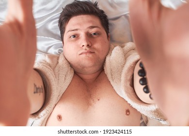 Man On White Bed Wakes Up Stretching High Key, Closeup