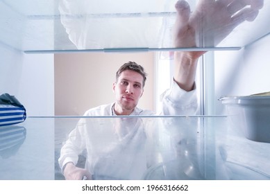 Man Open Fridge To Take Something To Eat, View From Inside