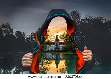 Man with open jacket. Instead of the body you can see the castle philipsruhe in Hanau and the reflection in the lake. the natural background is gray. Photoshop mood