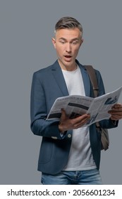 Man With Open Mouth Reading Newspaper