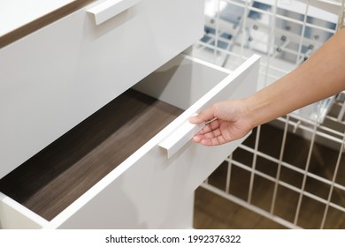 Man Open Shelf, Pull Open Drawer Wooden In Cabinet.	