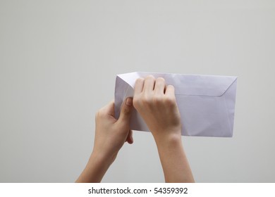 Man Open A White Envelope