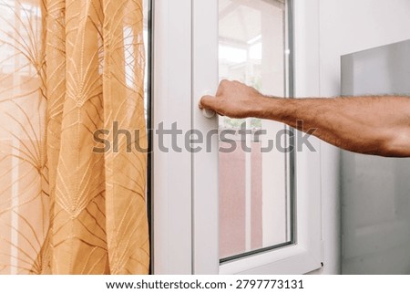 Man Open Window To Check With Fresh Air And Cool Home In Summer Heat house burping trend