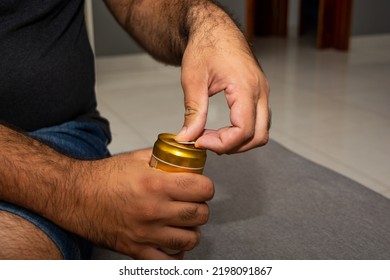 Man Opening Beer Can, Indoors On A Weekend