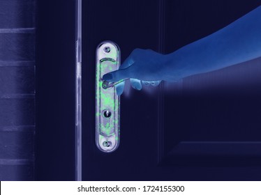 Man Opening Door, Closeup View Under UV Light. Avoid Touching Surfaces In Public Spaces During Coronavirus Outbreak