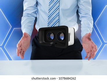 Man opening hands and interacting with virtual reality headset with hexagons