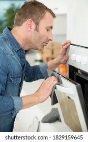 A Man Opening Oven Door