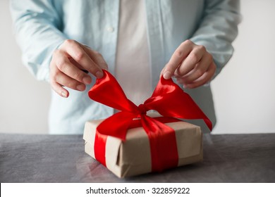 Man Opening Present