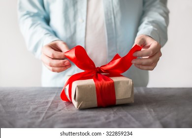 Man Opening Present