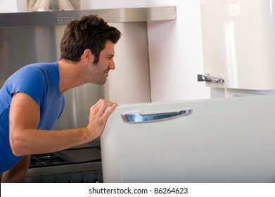 Man Opening The Refrigerator