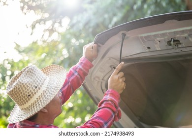 Man Opening And Set Up Front Car Bonnet To Checking Up The Engine. Car Maintenance Concept