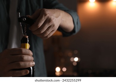 Man opening wine bottle with corkscrew on blurred background, closeup. Space for text - Powered by Shutterstock