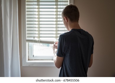 Man Opening/closing A Blind.