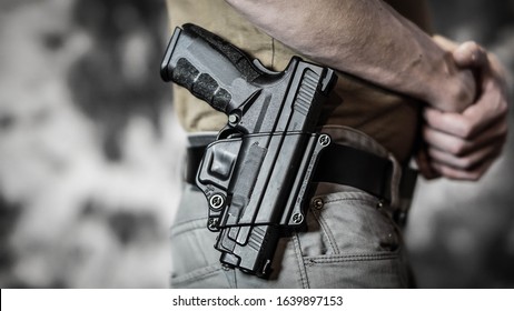 Man Openly Carrying A Pistol On His Belt. Open Carry And Second Amendment Concept.