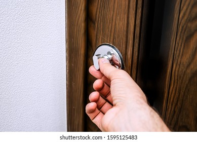 Man opens the door in apartment - Shutterstock ID 1595125483