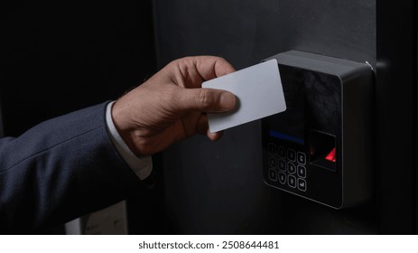 A man opens the door with a card. Modern electronic lock. Keyless Entry - Powered by Shutterstock