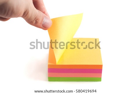 The man opens the sticker for reminders. isolated on white background, office work