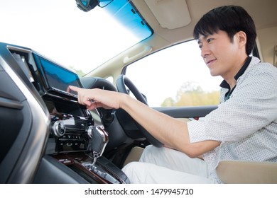 A man operating car navigation